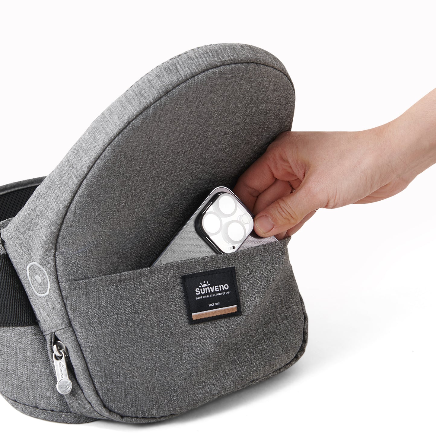 Collapsible hip seat carrier featuring a pocket for phone storage, enhancing convenience for busy parents.
